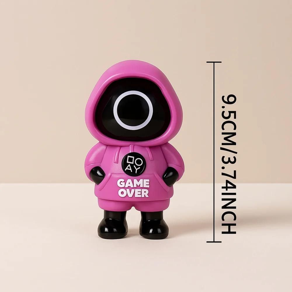 Toy figure Squid Game in a red hood with 'GAME OVER' text on a dark background